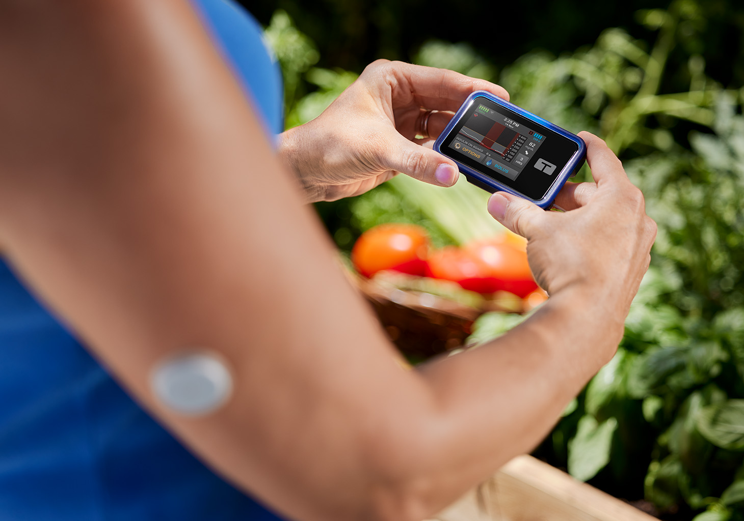 Woman Gardening while Wearing t:slim X2 Insulin Pump and FreeStyle Libre 2 Plus Sensor