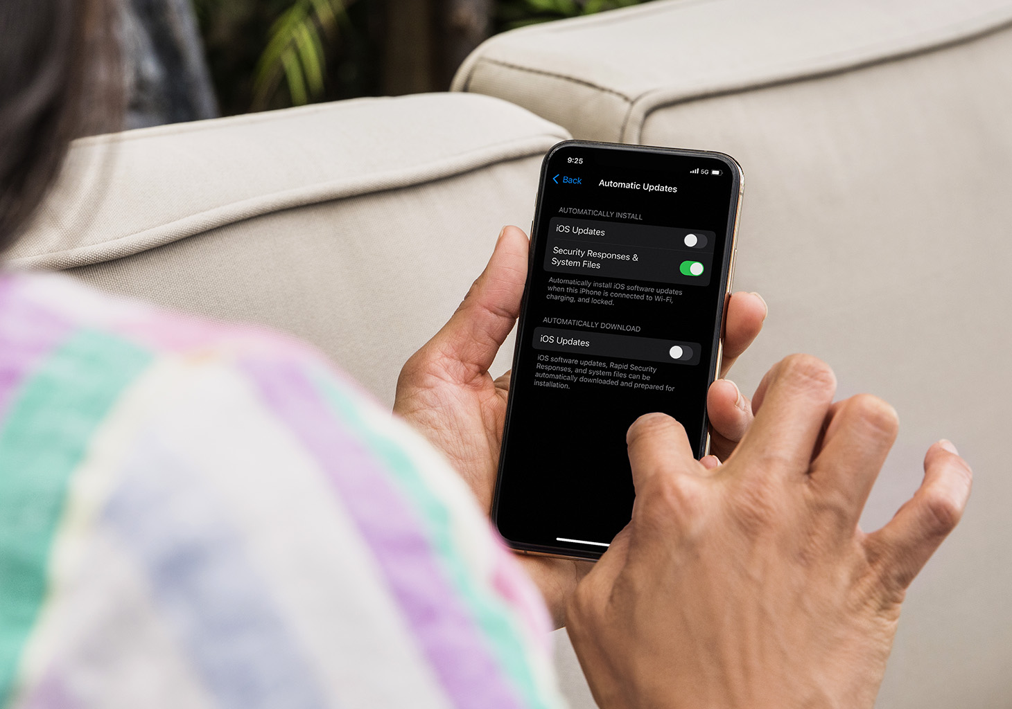 Woman Updating Automatic Updates in iOS Settings
