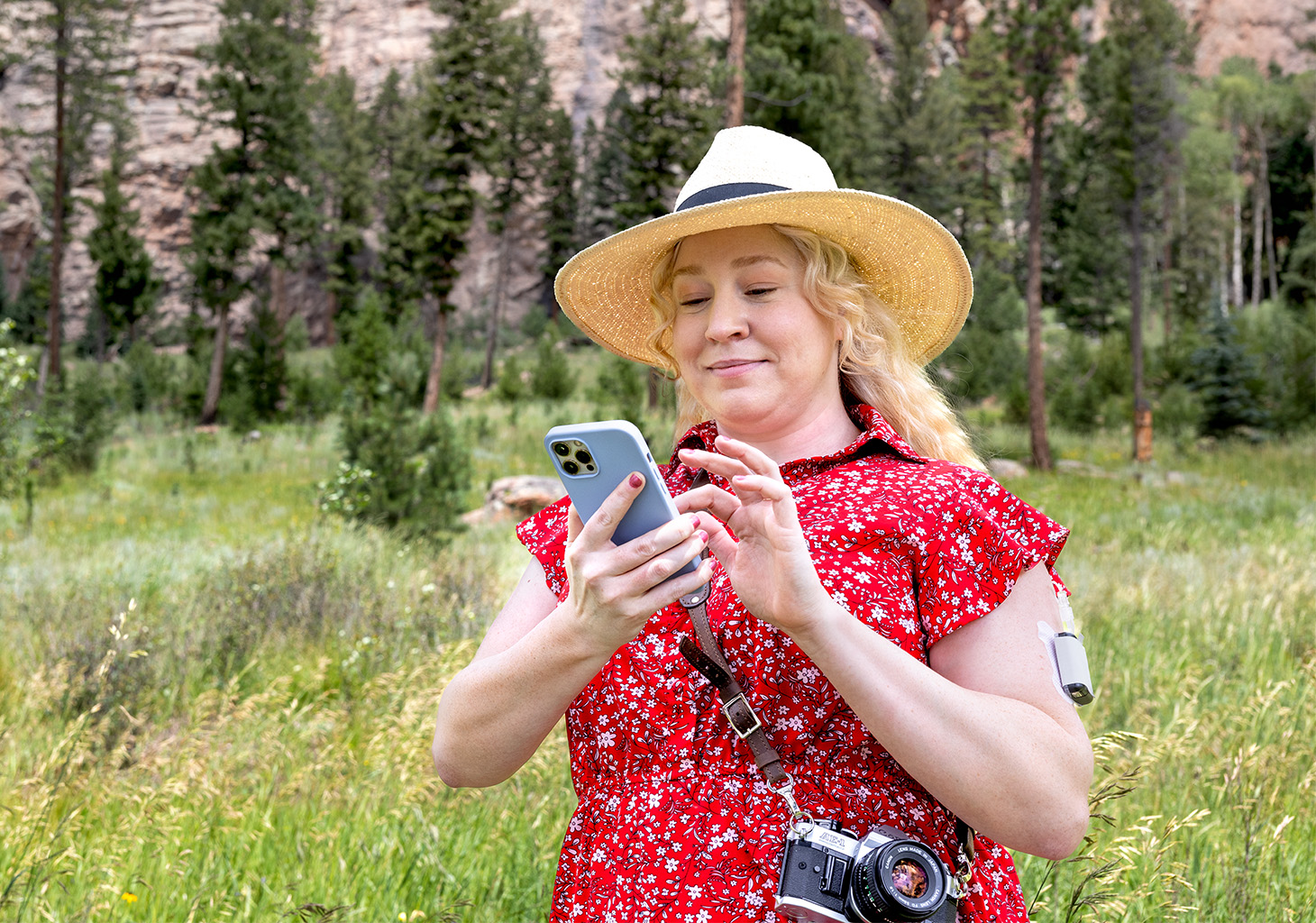 Woman Looking at Mobile App with Tandem Mobi Insulin Pump