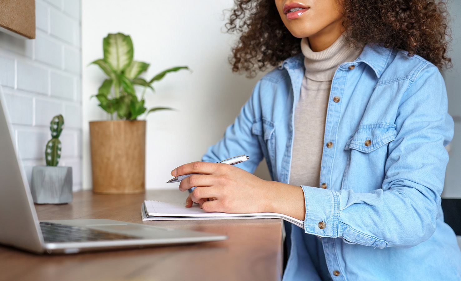 Woman writing down notes